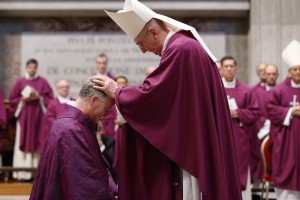 Archbishop Diarmuid Martin of Dublin blesses newly ordained Bishop Paul Tighe, a priest of the Archdiocese of Dublin, during his ordination to the episcopate in St. Peter's Basilica at the Vatican Feb. 27, 2016. (Photo courtesy Paul Haring, Catholic News Service)